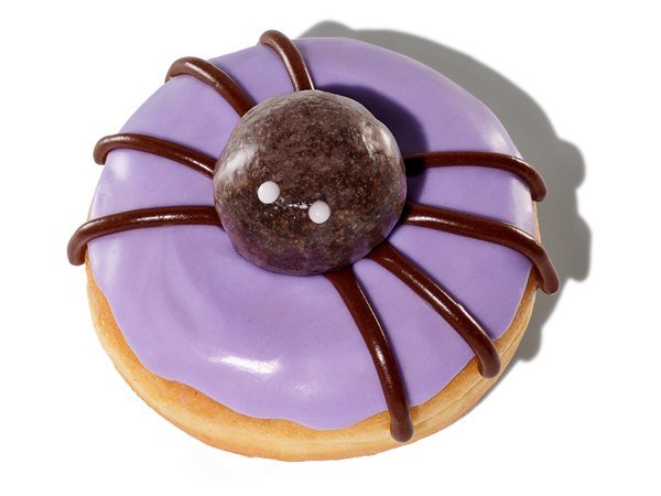Dunkin' Spider Donut with purple icing and a chocolate Munchkin spider