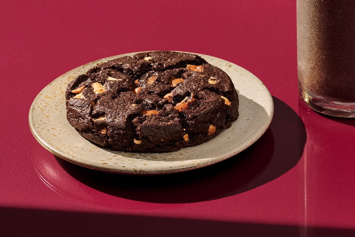 Starbucks Venti Black Night Cookie, a large dark cocoa cookie with caramel and white chocolate pieces