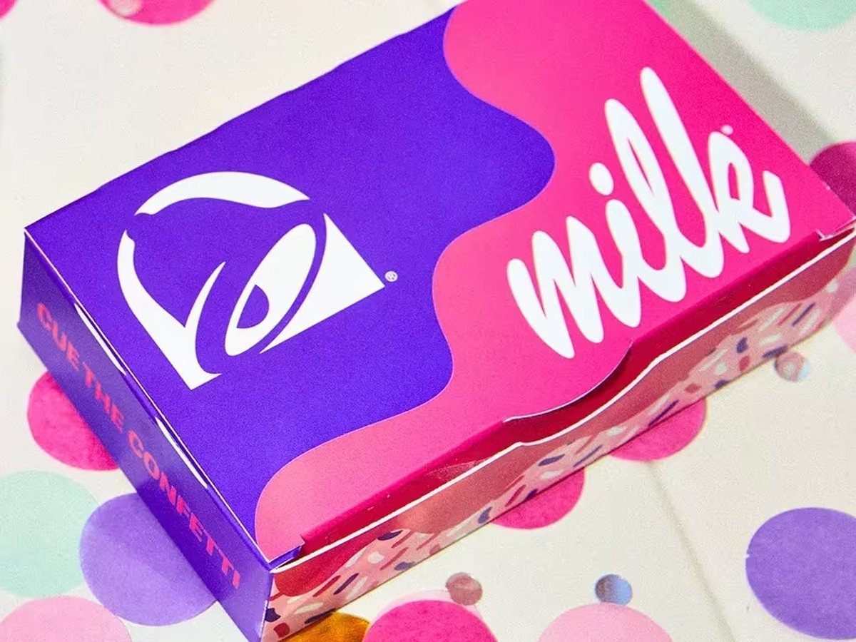 Taco Bell x Milk Bar Birthday Cake Empanada in its custom Cue the Confetti box